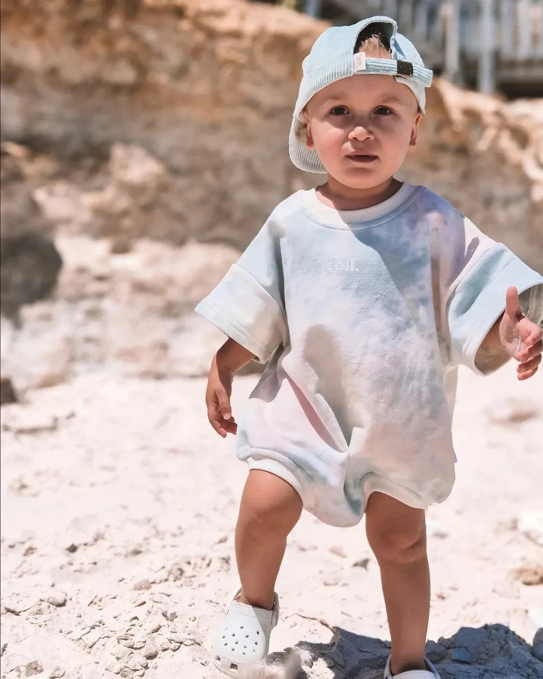 Kids French Terry Romper - Tie Dye Summer 24 soll. the label